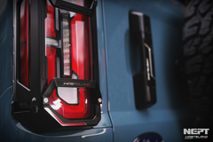 Close-up of a ford bronco tail light with Westland branding on a blue background