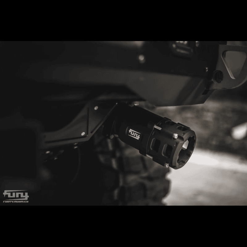 exhaust tip installed on a jeep wrangler close up view black in color