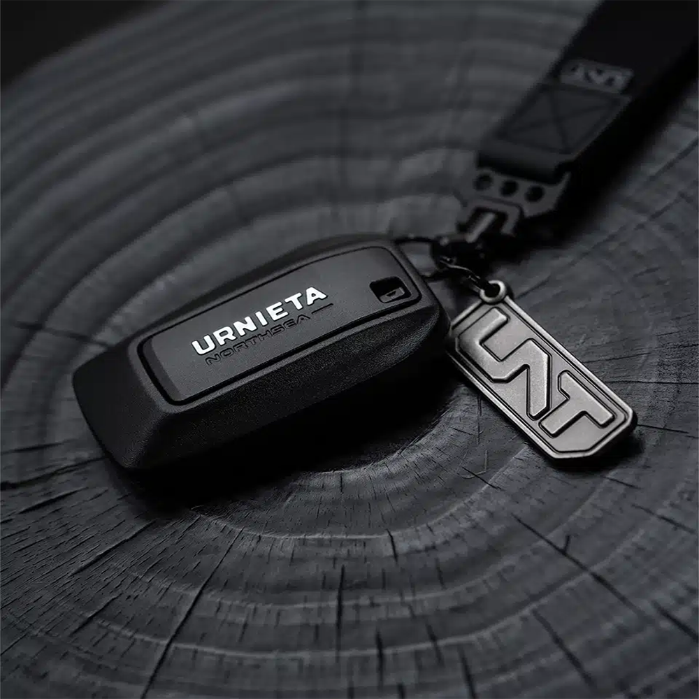 Side angle of the URNIETA key shell highlighting its ergonomic shape and durable construction for daily use.