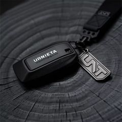 Side angle of the URNIETA key shell highlighting its ergonomic shape and durable construction for daily use.