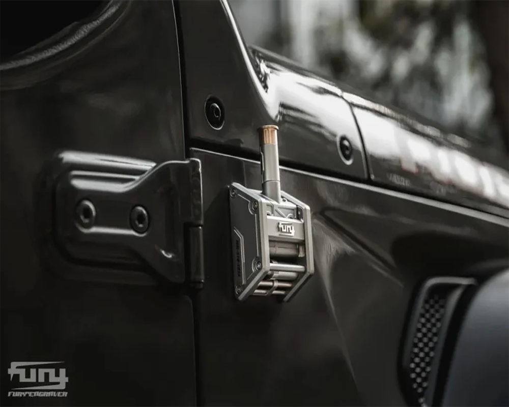 Silver jeep antenna mount on the passenger side of a jeep wrangler