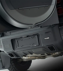 Side-angle view of the PLUMB rear bumper on a Defender 110, emphasizing clearance and protection for off-road terrain.