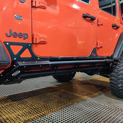 jeep side skirt installed on a red jeep wrangler