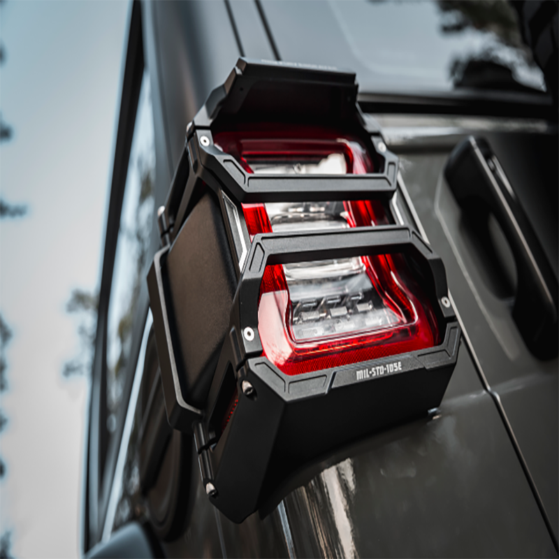 Close-up view of rugged tail light guards installed on a Jeep Wrangler, enhancing protection