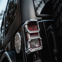 Load image into Gallery viewer, Image of Jeep Wrangler tail light covers in black, designed for optimal durability and style