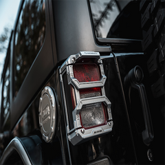 Image of Jeep Wrangler tail light covers in black, designed for optimal durability and style