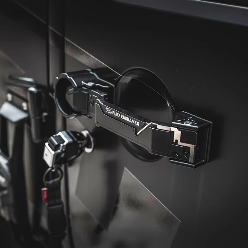 Close-up of the black aluminum door handle installed on a Jeep JK door.