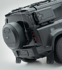Full rear shot of a Land Rover Defender equipped with the PLUMB heavy-duty bumper and integrated step for enhanced off-road utility.