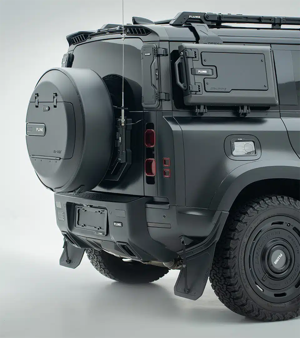Rear bumper installation process on a classic Defender, featuring PLUMB’s bolt-on design for easy mounting.