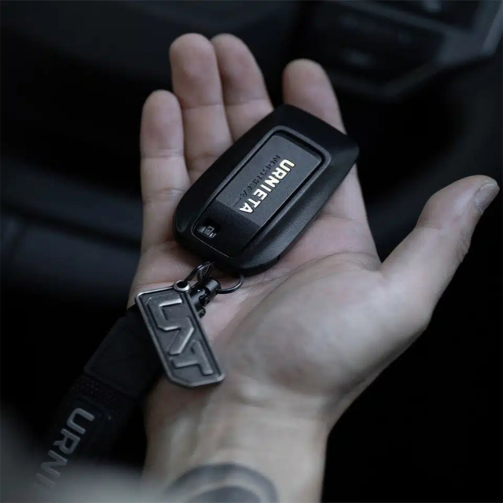 URNIETA key fob kit with open view showing internal structure for easy installation in Toyota Land Cruiser Prado 250.